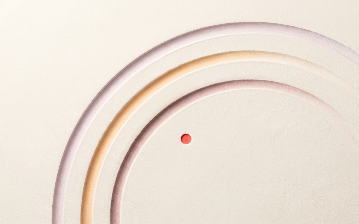 Three open mauve, apricot and auburn grooves arc across one warm-ivory matte plaster surface beside a tiny coral point.