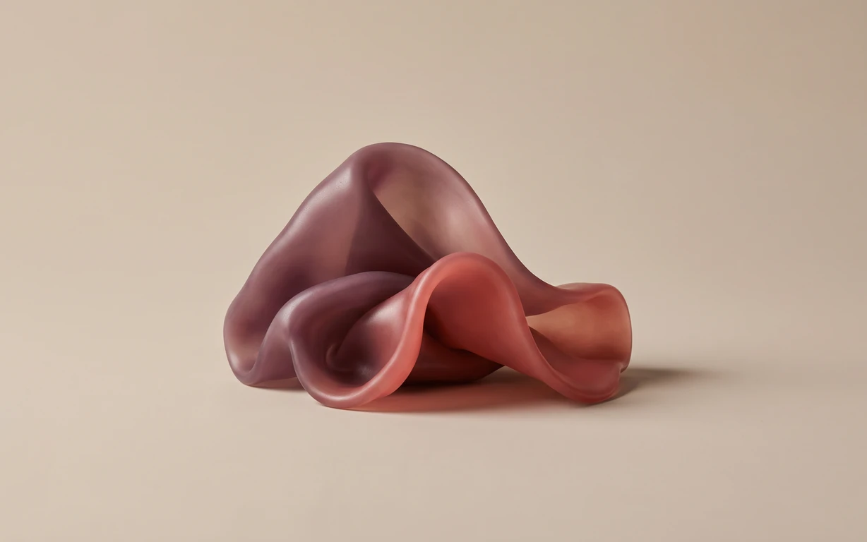 Abstract still life of softly folded plum and coral forms on a warm beige seamless surface, lit with gentle highlights and a grounding shadow.