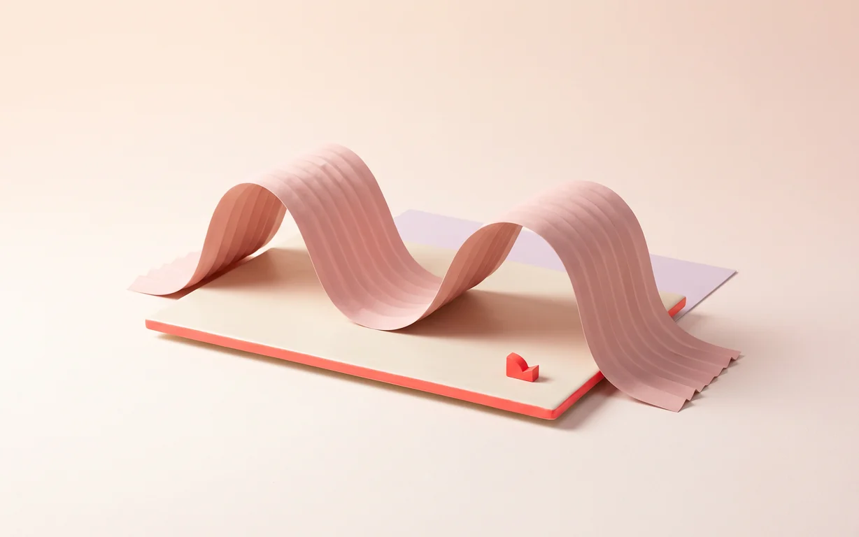 A blush paper ribbon curves across an ivory platform with a pale lavender panel behind.